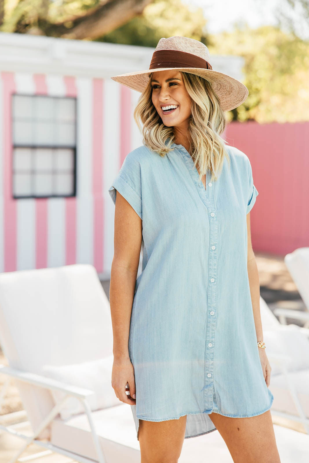 blue and white striped shirt dress with straw boater hat