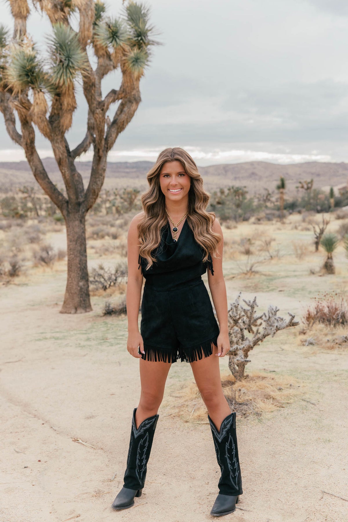 Stockyards Suede Fringe Romper in Black